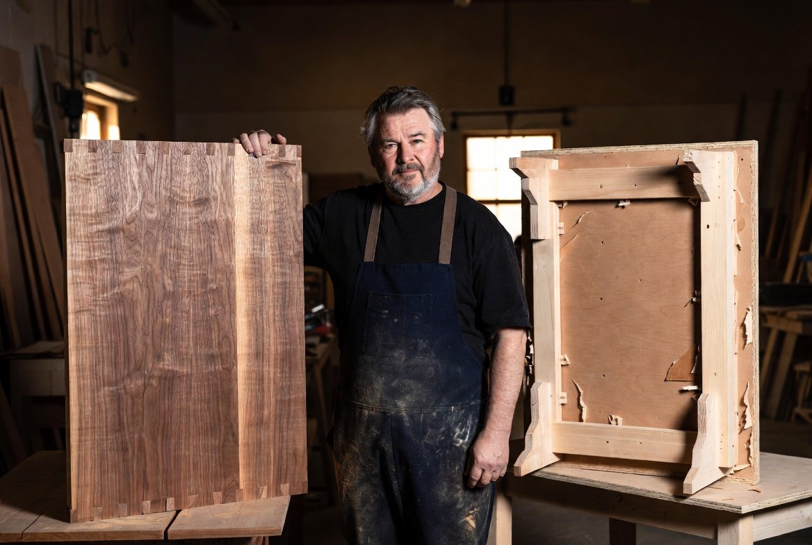 man showing some nice wood furniture